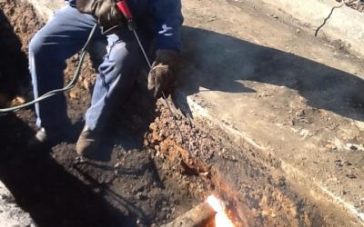 We offer on site welding here is one of our welders use a slice rod to cut a buried railroad rail