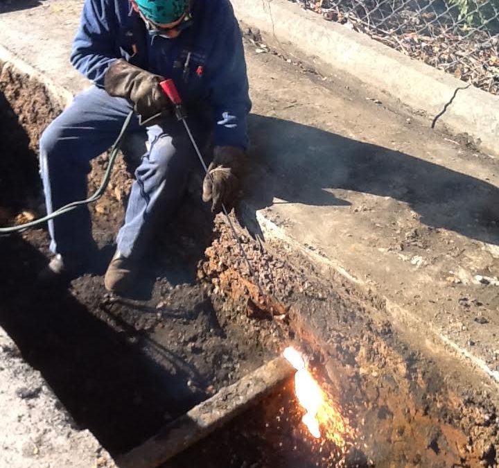 We offer on site welding here is one of our welders use a slice rod to cut a buried railroad rail